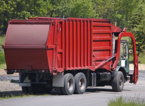 Team performing site safety check before skip delivery