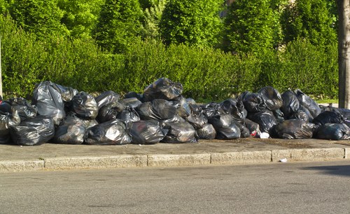 Different types of skips lined up for waste management