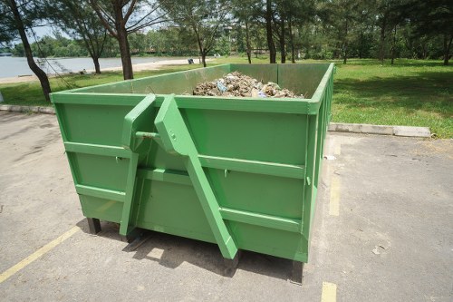 Muck away trucks collecting different types of waste